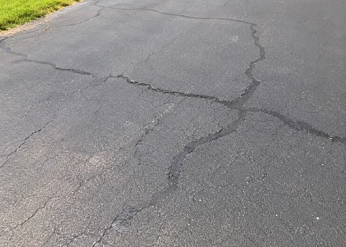 Customer-style asphalt photo showing visible cracking