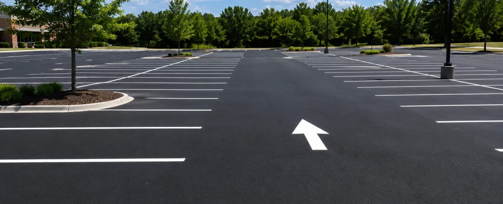 Commercial parking lot with clear white lines and directional markings